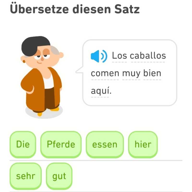 Screenshot Duolingo: Los caballos domen mut bein aquí/Die Pferde essen hier sehr gut